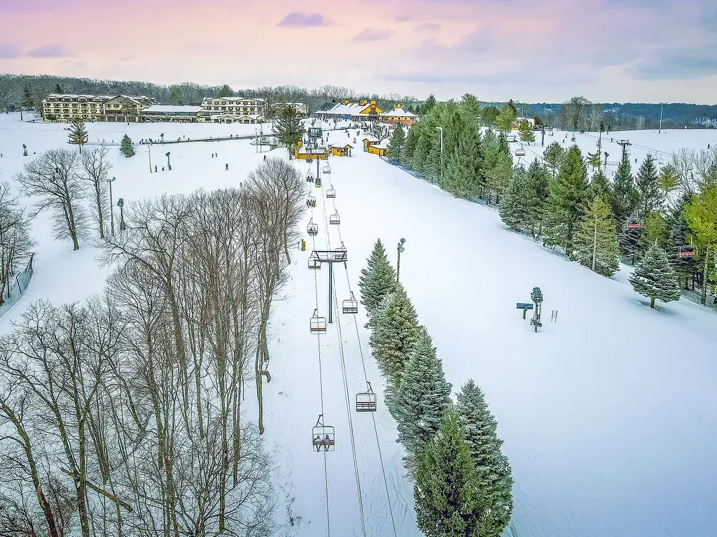 A ski lift and lodge in winter