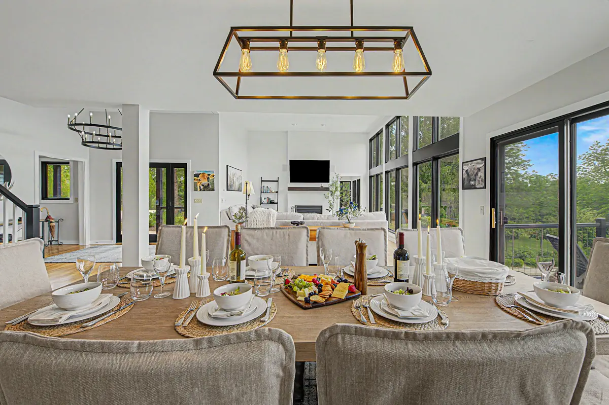 Dining table set for a group under a statement light
